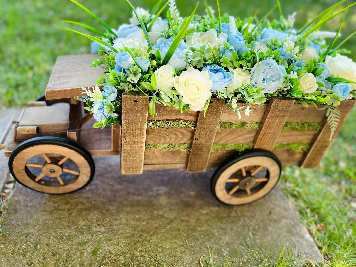 Extra large truck garden planter filled with artificial flowers