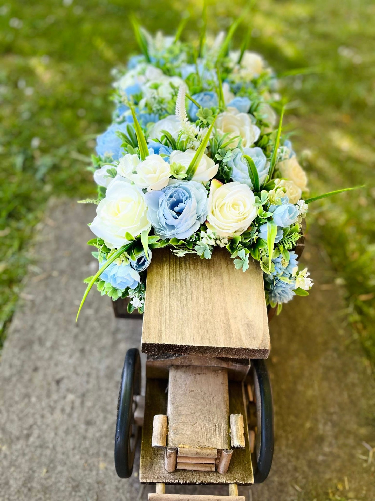 Extra large truck garden planter filled with artificial flowers