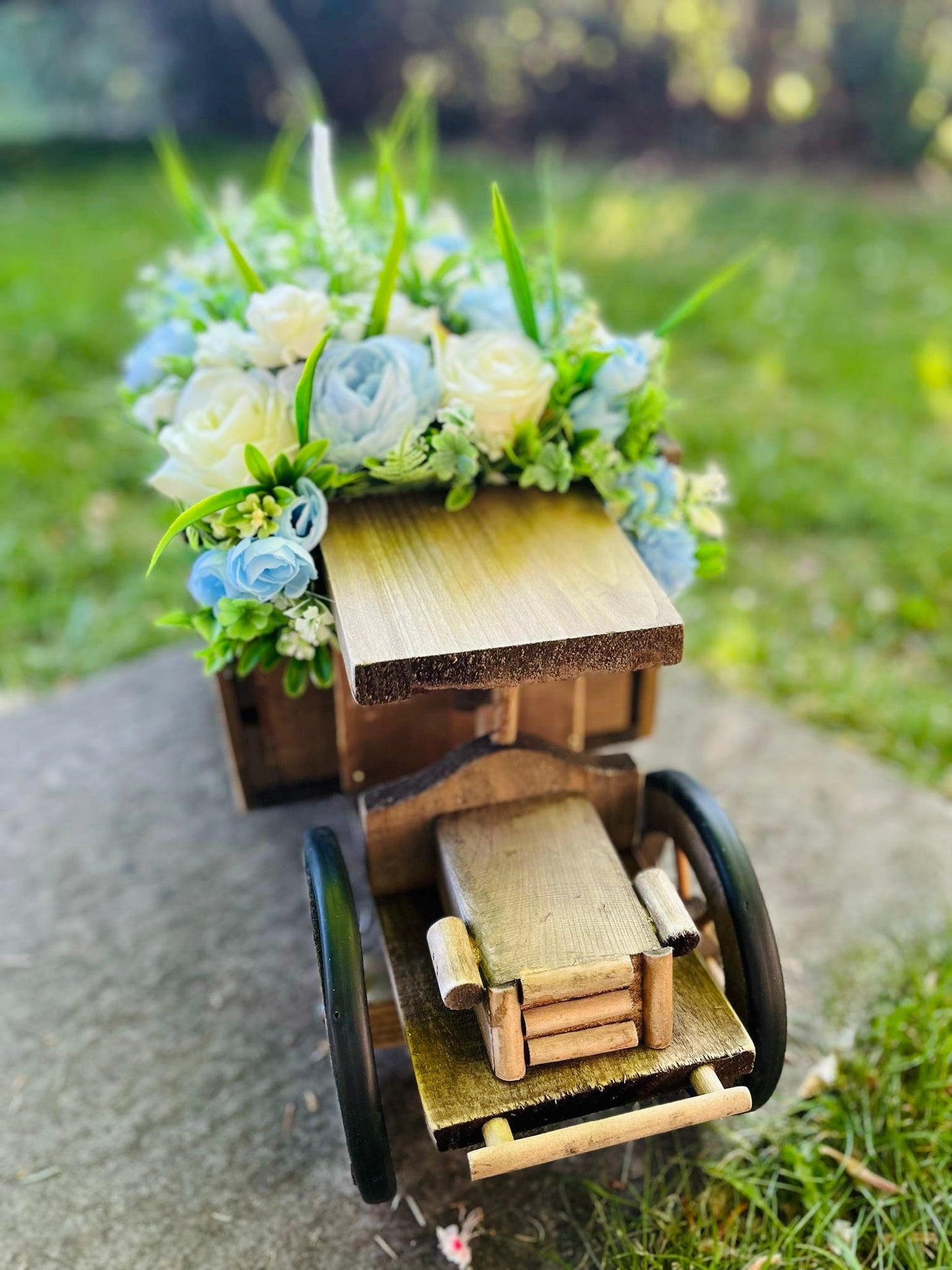 Extra large truck garden planter filled with artificial flowers