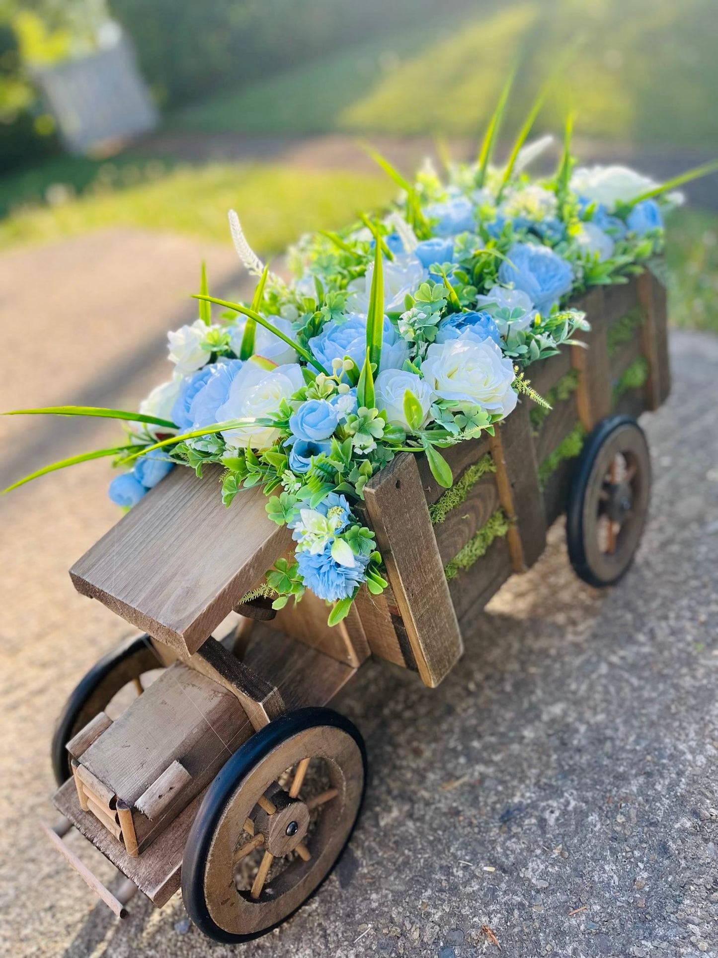 Extra large truck garden planter filled with artificial flowers