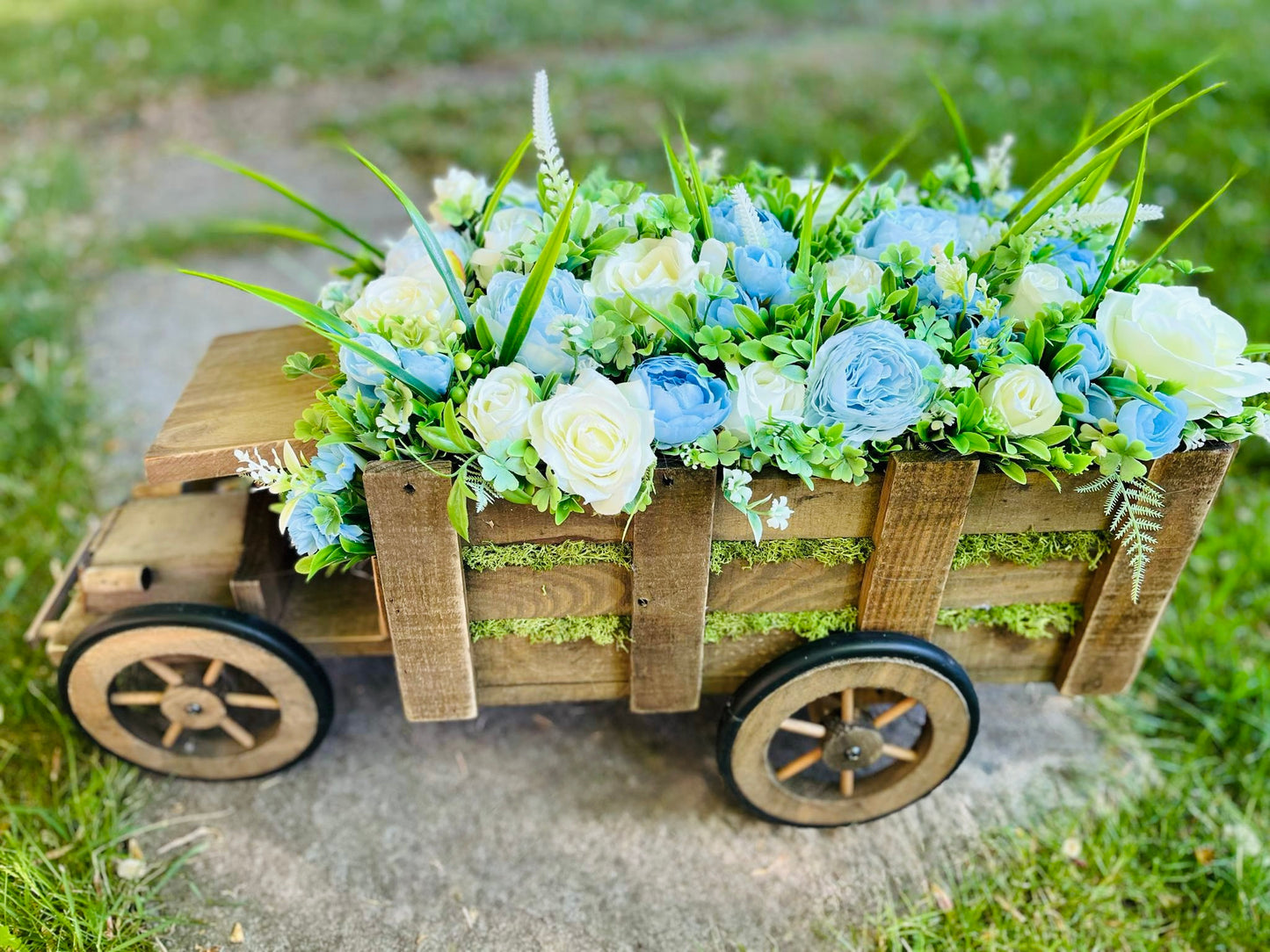 Extra large truck garden planter filled with artificial flowers