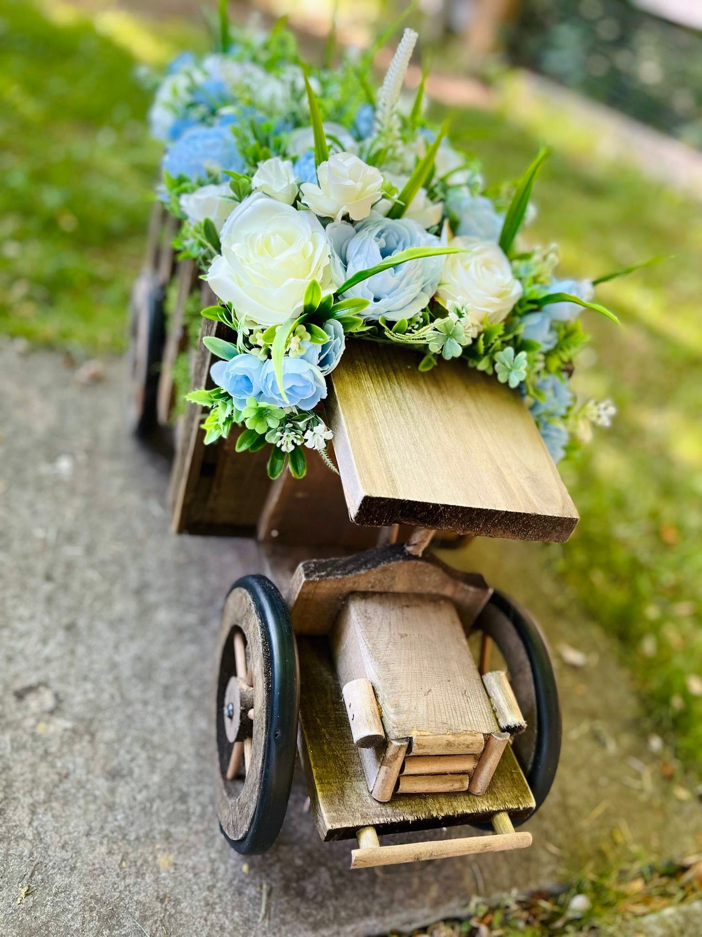Extra large truck garden planter filled with artificial flowers