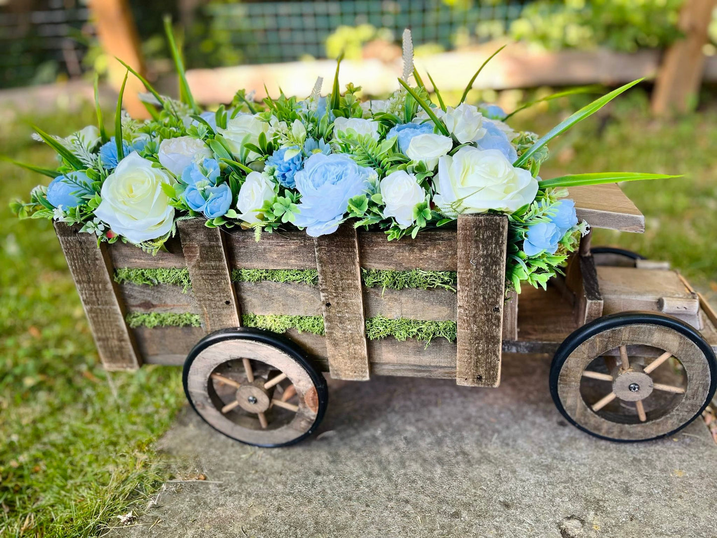 Extra large truck garden planter filled with artificial flowers
